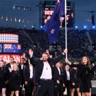 Flagbearers Tom Walsh and Joelle King lead the New Zealand team. PHOTO: GETTY IMAGES