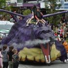 A creative creature gets fired up at the parade.