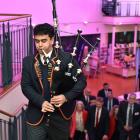 John McGlashan College pupil and Class Act recipient Qwenton McKenzie plays the bagpipes to...