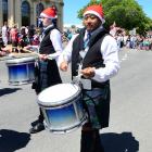 Kane Taualofa keeps in beat with the pipe band.