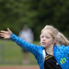 Genevieve Hodgson, 8, gets the gumboot flying during the children’s Highland Games at the...