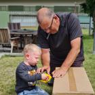 Pop and Noah (Trevor Bell, and Noah, 2,) saw a big cardboard box to pieces in Cromwell. PHOTO:...