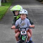 Look out! . . . Spencer Bell, 6, and Noah Bell, 2, ride their shared Christmas present in Gore....