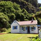 This cottage at Te Ngaru was built about 1904 and has hosted generations of the same family....
