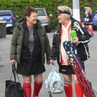 Nellie McDonald, 74 (left), and Dianne Foley, 77, both of Auckland, carry their gear before their...