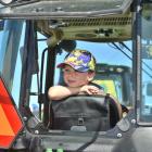 Finley Munro, 3, of Winton, relaxes in a John Deere tractor. PHOTOS: GREGOR RICHARDSON