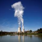 Steam rises from cooling towers of the Electricite de France nuclear power station in Civaux,...