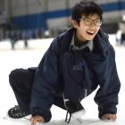 Zev Bai, 14, of China, a year 10 pupil at Bayfield High School, has a laugh as he lowers his...