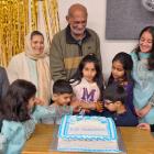 Eid Cake cutting by the senior most menbers of Dunedin Pakistan Society