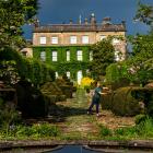 A gardener (above right) prepares the Highgrove gardens for Topiary Day on May 12 this year. The...