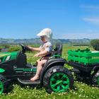 Went to mow a meadow ... Brynleigh Lobb, 10 months, rides a toy tractor at North Taieri on...
