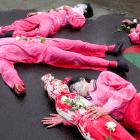 Activists stage a theatrical show during a protest against Israel and in support of Palestinians...