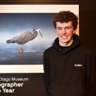 The 2025 Tūhura Otago Museum Photographer of the Year Sam McGee, 17, of Dunedin, stands with his...