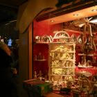 A visitor stands next to a stall at the Striezelmarkt Christmas market on its opening day in...