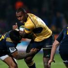 Malakai Fekitoa tackles Tevita Kuridrani for the Highlanders in their win over the Brumbies....