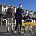 North East Valley Normal School pupil Immanuel Mombi with teacher aide Kirsten Kane and bike...