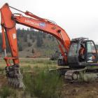 Colin Ashmore of BWC Ltd, Cromwell,  helps with  the first earthworks on the new Cromwell...