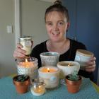 Lighthouse Candle maker Mary Woodrow with a selection of her candles. Photo by Samuel White.
