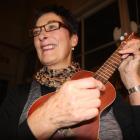 Ukulele Ensemble band member Ann Willetts strums  a musical classic. Photo: Shannon Gillies