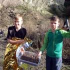 After their rescue, Harvey Brown (left) and Carter Pearson display the 'treasures' they gathered...