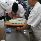An Otago Corrections Facility prisoner adds the finishing touches to a celebratory cake marking...