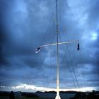 The flagstaff, at the Waitangi Treaty grounds, Bay of Islands, flies the New Zealand flag (top),...