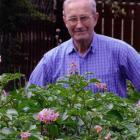 Dave Young stands behind his potato crop in his Mosgiel garden in December.