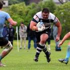 University A players Nick Connell (No 6) and Sam Sturgess prepare to tackle charging Southern...