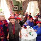 Dunedin Red reveller Queen Karen Lester (left) celebrate the brithday of Ros McKenzie (84) as...