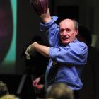 Trevor Plumbly (right) conducts his last charity auction on Saturday night at the Otago Community...