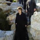 The Prime Minister , Helen Clark, is followed by Dunedin Mayor Peter Chin on a tour of the...