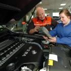 Queens High School pupil Hannah Gray receives training on a piece of diagnostic equipment from...