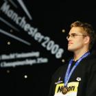 Moss Burmester, of New Zealand, stands on the podium wearing the gold medal he received for...