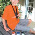 Making a splash: Wanaka’s Matt Henderson (11) with the bronze medal and South Island placegetting ribbons from the New Zealand junior swimming championships held last month, where he was one of only three Otago medallists.