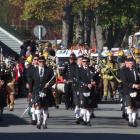 Crowds watch the 24th annual Arrowtown Autumn Festival parade on Buckingham St. Photo by Chris...