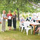 Special day: Castlewood residents enjoy afternoon tea in the garden as (from left) Alexandra...