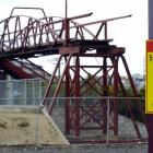 A sign warning pedestrians against taking a shortcut across the railway lines. Photo by Gerard O...