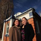 Amie Pont (left) hands over managerial responsibility for Burn 729am radio station to Melissa...