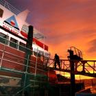 Tradesmen board the Fiordland tourism vessel Lady of the Sounds at the Kitchener St slipway...