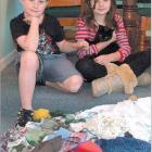 Feline thief: Jessie (9, left) and Sammy (12) Irvine with Roxy and her stolen bounty.