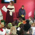 Children's book illustrator Robyn Belton reads children a book containing some of her work at the...