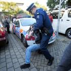 An 18-year-old student resists police.