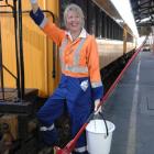 Taieri Gorge Railway assistant guard Judy Mann prepares carriages for today's &quot;suburban rail...