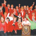 Trophy comes home: Roxburgh Pioneer Generation Brass Band members show their elation after...