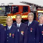 Dunedin firefighters, from left, John Griffiths, Richard Huuskes, Jock Mackay, Greg Casey, Murray...
