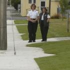 St John first aid officer Jan-Marie Fitzgerald and paramedic Laura Vincent look at a guy rope...