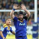 Andrew Hore attempts to charge down a kick during the Highlanders-Blues Super 15 rugby match at...