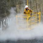 Dunedin Crane Hire equipment  suspends University of Otago property services worker Graeme Mackie...