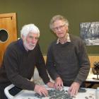 Graeme Collett, a project volunteer from Dunedin, helps  Russell Beck (right)  sort through rock...