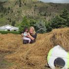 Hannah McKenzie (17), from Christchurch, comforts Charly Light (2), from Christchurch, after...